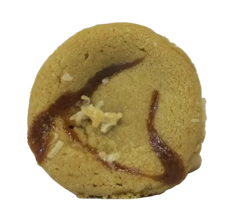 Tumbeler sugar Cookie with caramel swirl and coconut pieces on a white background