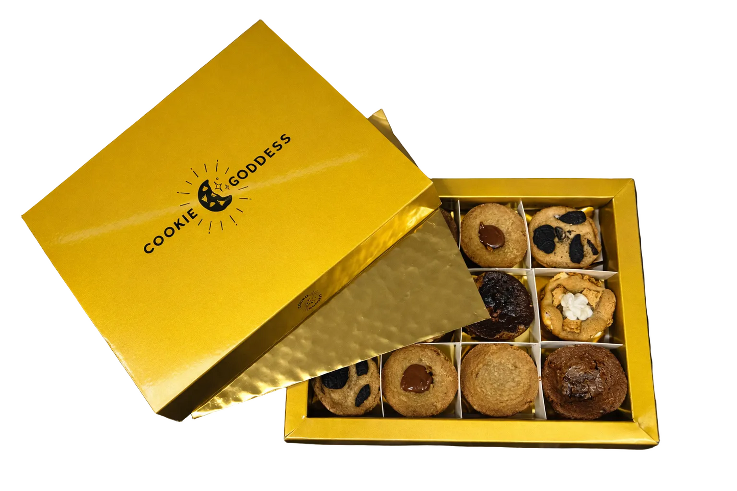 Gold box of assorted cookies with 'Cookie Goddess' branding on a black satin background