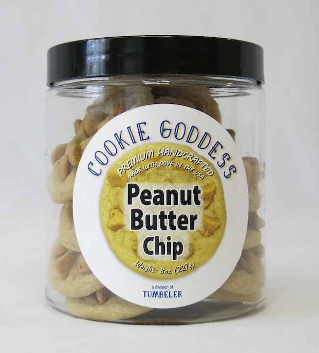 Jar of 'Cookie Goddess' Peanut Butter Chip cookies with a black lid on a white background